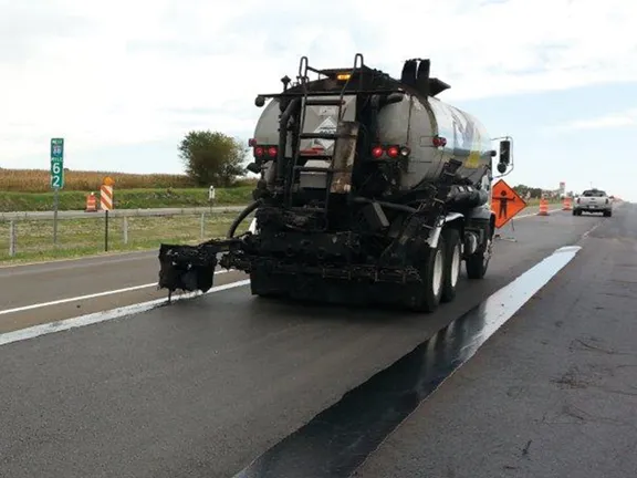 Tanker applying J-Band® VRAM along a highway centerline joint